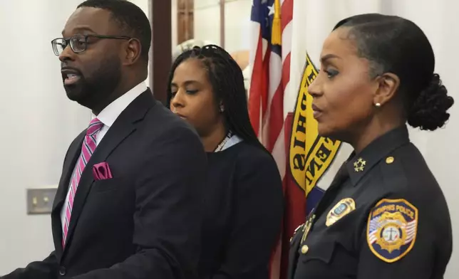 Mayor Paul Young, left, speaks during a news conference Thursday, Dec. 5, 2024, in Memphis, Tenn. (AP Photo/George Walker IV)