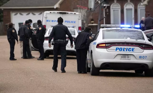 FILE - Members of the Memphis Police Department work a crime scene in Memphis, Tenn., Tuesday, Jan. 24, 2023. (AP Photo/Gerald Herbert, File)