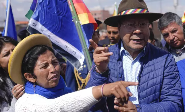 FILE - Julia Ramos, the newly named vice president of a faction of the Movement Towards Socialism (MAS) party, speaks with Bolivian President Luis Arce, in El Alto, Bolivia, Nov. 28, 2024. (AP Photo/Juan Karita, File)