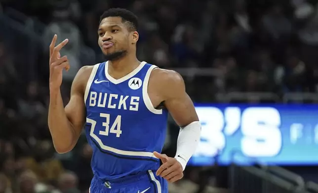 Milwaukee Bucks' Giannis Antetokounmpo gestures during the first half of an NBA basketball game against the Washington Wizards Saturday, Nov. 30, 2024, in Milwaukee. (AP Photo/Aaron Gash)