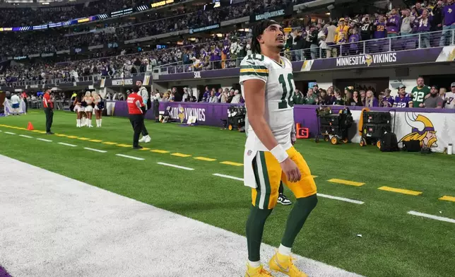 Green Bay Packers' Jordan Love walks off the field after an NFL football game against the Minnesota Vikings Sunday, Dec. 29, 2024, in Minneapolis. (AP Photo/Abbie Parr)