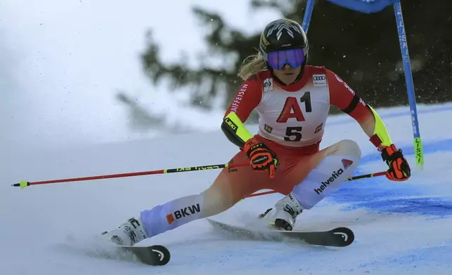 Switzerland's Lara Gut Behrami speeds down the course during an alpine ski, women's World Cup giant slalom race in Semmering, Austria, Saturday, Dec. 28, 2024. (AP Photo/Giovanni Auletta)