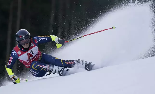 Sweden's Sara Hector speeds down the course during an alpine ski, women's World Cup Gian slalom race, in Semmering, Austria, Saturday, Dec. 28, 2024. (AP Photo/Piermarco Tacca)