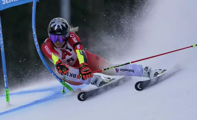 Switzerland's Lara Gut Behrami speeds down the course during an alpine ski, women's World Cup Gian slalom race, in Semmering, Austria, Saturday, Dec. 28, 2024. (AP Photo/Piermarco Tacca)