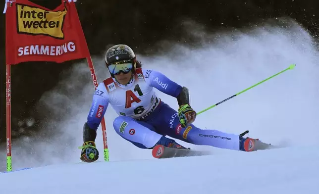 Italy's Federica Brignone speeds down the course during an alpine ski, women's World Cup giant slalom race in Semmering, Austria, Saturday, Dec. 28, 2024. (AP Photo/Giovanni Auletta)