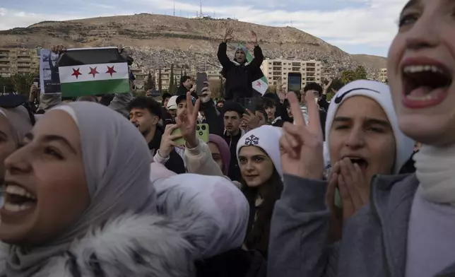 FILE - People gather to celebrate days after the fall of Bashar Assad's government at Umayyad Square in Damascus, Thursday, Dec. 12, 2024. (AP Photo/Leo Correa, File)