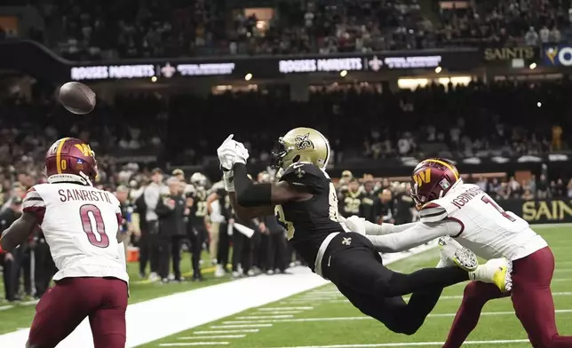 New Orleans Saints tight end Juwan Johnson (83) missed a two point conversion in the second half of an NFL football game against the Washington Commanders in New Orleans, Sunday, Dec. 15, 2024. (AP Photo/Gerald Herbert)