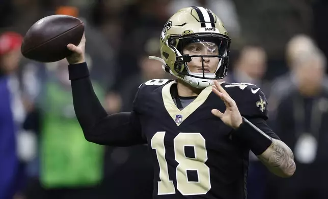 New Orleans Saints quarterback Spencer Rattler (18) throws a pass in the second half of an NFL football game against the Washington Commanders in New Orleans, Sunday, Dec. 15, 2024. (AP Photo/Butch Dill)