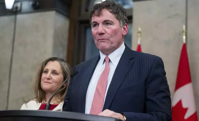 Minister of Public Safety, Democratic Institutions and Intergovernmental Affairs Dominic LeBlanc delivers remarks on Parliament Hill in Ottawa, Ontario, Wednesday, Dec. 11, 2024. (Spencer Colby/The Canadian Press via AP)