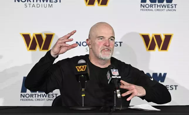 Washington Commanders head coach Dan Quinn speaks to members of the media after an NFL football game against the Philadelphia Eagles, Sunday, Dec. 22, 2024, in Landover, Md. (AP Photo/Nick Wass)