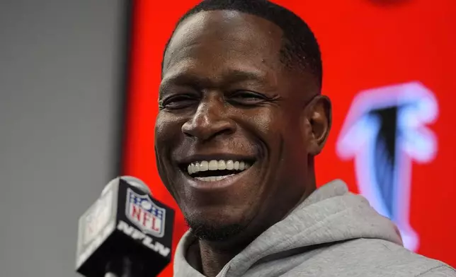 Atlanta Falcons head coach Raheem Morris speaks during a news conference after an NFL football game against the New York Giants, Sunday, Dec. 22, 2024, in Atlanta. (AP Photo/John Bazemore)