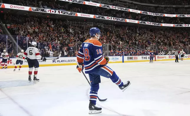 Edmonton Oilers' Zach Hyman (18) celebrates after a goal against the Florida Panthers during second-period NHL hockey game action in Edmonton, Alberta, Monday, Dec. 16, 2024. (Jason Franson/The Canadian Press via AP)