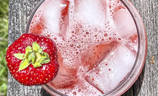 This 2021 image shows a strawberry-basil tonic mocktail. (Suzanne Podhaizer via AP)