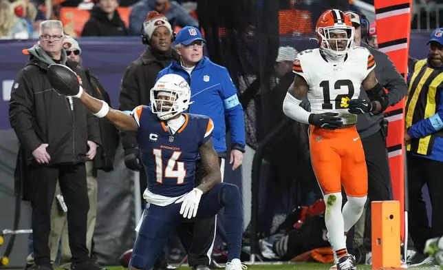 Denver Broncos wide receiver Courtland Sutton (14) celebrates his first down during the first half of an NFL football game against the Cleveland Browns, Monday, Dec. 2, 2024, in Denver. (AP Photo/Jack Dempsey)