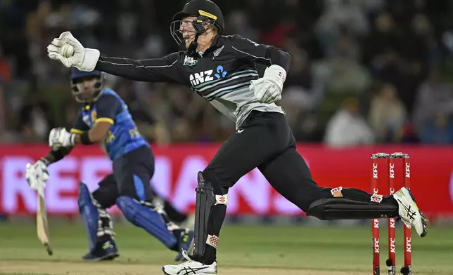 New Zealand's Mitch Hay fields, during the second Twenty20 international cricket match between New Zealand and Sri Lanka at Mt. Maunganui, New Zealand Monday, Dec. 30, 2024. (Andrew Cornaga/Photosport via AP)