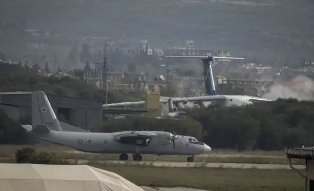 Russian aircraft taxi on the tarmac of the Hmeimim Air Base, a Syrian airbase currently operated by Russia, located southeast of the city of Latakia in the town of Hmeimim, Syria, on Monday, Dec.16, 2024. (AP Photo/Leo Correa)