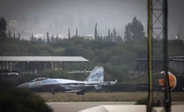 A Russian fighter jet taxi on the tarmac of the Hmeimim Air Base, a Syrian airbase currently operated by Russia, located southeast of the city of Latakia in the town of Hmeimim, Syria, on Monday, Dec.16, 2024. (AP Photo/Leo Correa)