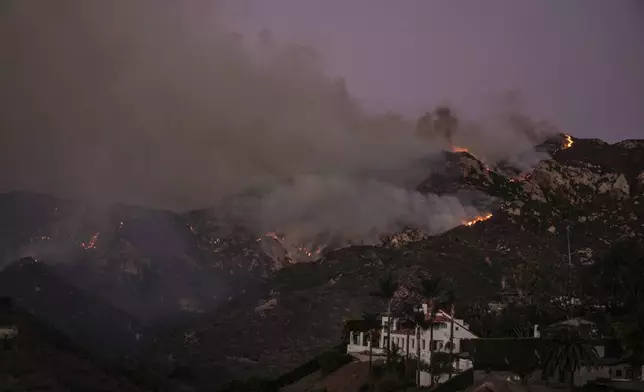 FILE - The Franklin Fire burns in Malibu, Calif., Dec. 10, 2024. (AP Photo/Jae C. Hong, File)