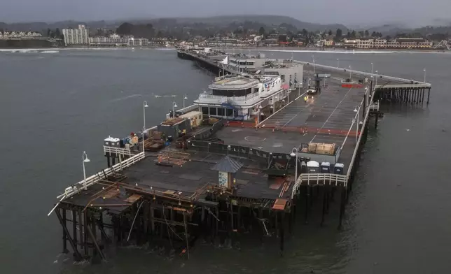 The damaged Santa Cruz Wharf is visible in Santa Cruz, Calif., Tuesday, Dec. 24, 2024. (AP Photo/Nic Coury)