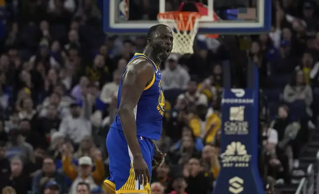 Golden State Warriors forward Draymond Green reacts after making a three-point basket against the Phoenix Suns during the first half of an NBA basketball game Saturday, Dec. 28, 2024, in San Francisco. (AP Photo/Godofredo A. Vásquez)