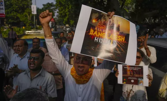 A member of Vishwa Hindu Parishad (VHP) shouts during a protest condemning the atrocities on Bangladesh Hindus and the recent arrest of International Society for Krishna Consciousness (ISKCON) priest Chinmoy Krishna Das by Dhaka police, outside the Bangladesh High Commission in Mumbai, India, Monday, Dec. 2, 2024. (AP Photo/Rafiq Maqbool)