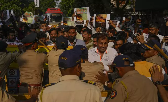 Members of Vishwa Hindu Parishad (VHP) shout slogans as they are stopped by police during a protest outside the Bangladesh High Commission in Mumbai, India, Monday, Dec. 2, 2024. (AP Photo/Rafiq Maqbool)