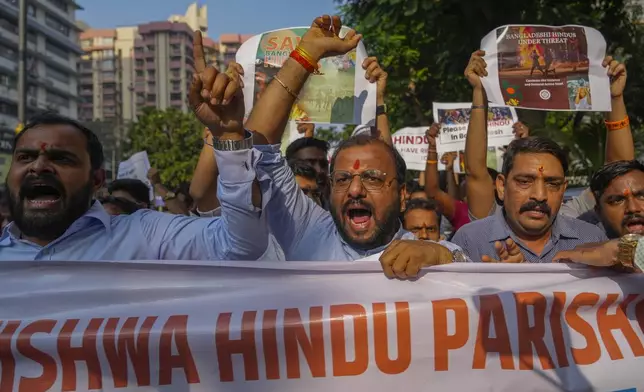 Members of Vishwa Hindu Parishad (VHP) shout slogans during a protest outside the Bangladesh High Commission in Mumbai, India, Monday, Dec. 2, 2024.(AP Photo/Rafiq Maqbool)