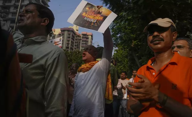 A member of Vishwa Hindu Parishad (VHP) shouts during a protest condemning the atrocities on Bangladesh Hindus and the recent arrest of International Society for Krishna Consciousness (ISKCON) priest Chinmoy Krishna Das by Dhaka police, outside the Bangladesh High Commission in Mumbai, India, Monday, Dec. 2, 2024. (AP Photo/Rafiq Maqbool)