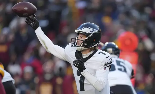 Philadelphia Eagles quarterback Kenny Pickett (7) throws a pass during the second half of an NFL football game against the Washington Commanders, Sunday, Dec. 22, 2024, in Landover, Md. (AP Photo/Stephanie Scarbrough)