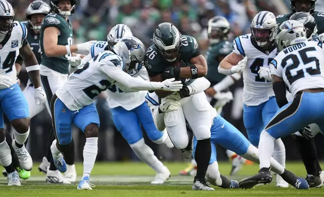 Philadelphia Eagles running back Saquon Barkley (26) runs with the ball during the first half of an NFL football game against the Carolina Panthers on Sunday, Dec. 8, 2024, in Philadelphia. (AP Photo/Matt Slocum)