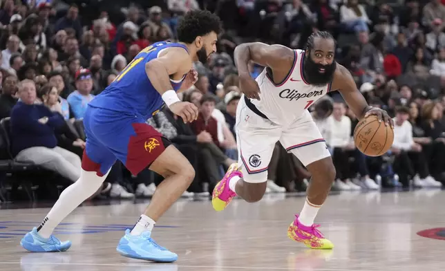 Los Angeles Clippers guard James Harden, right, drives toward the basket as Denver Nuggets guard Jamal Murray defends during the second half of an NBA basketball game, Sunday, Dec. 1, 2024, in Inglewood, Calif. (AP Photo/Mark J. Terrill)