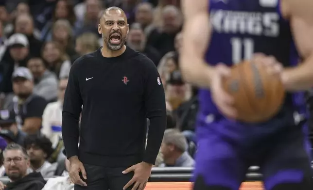 Houston Rockets head coach Ime Udoka shouts from the bench during the second half of an Emirates NBA Cup basketball game against the Sacramento Kings in Sacramento, Calif., Tuesday, Dec. 3, 2024. (AP Photo/Randall Benton)