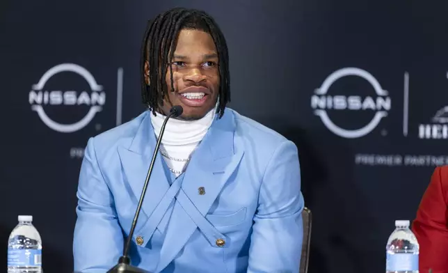 Heisman Trophy finalist Travis Hunter, of Colorado, speak at a college football press conference, Saturday, Dec. 14, 2024, in New York. (AP Photo/Corey Sipkin)