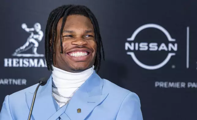 Heisman Trophy finalist Travis Hunter, of Colorado, speak at a college football press conference, Saturday, Dec. 14, 2024, in New York. (AP Photo/Corey Sipkin)