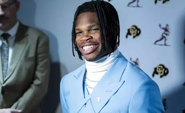 Heisman Trophy finalist Travis Hunter, of Colorado, speaks speaks at a college football press conference, Saturday, Dec. 14, 2024, in New York. (AP Photo/Corey Sipkin)