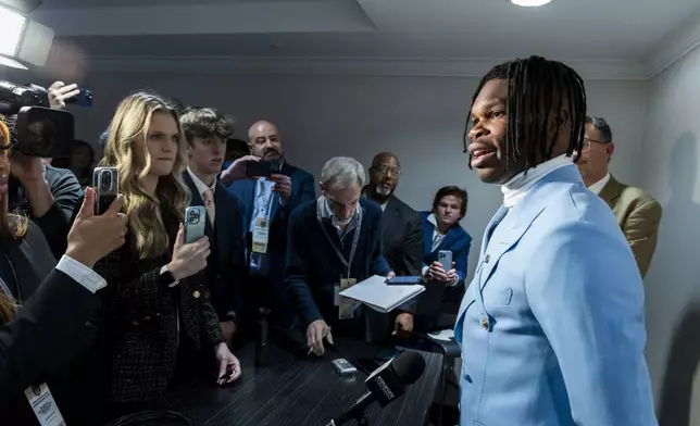 Heisman Trophy finalist Travis Hunter, of Colorado, speaks speaks at a college football press conference, Saturday, Dec. 14, 2024, in New York. (AP Photo/Corey Sipkin)