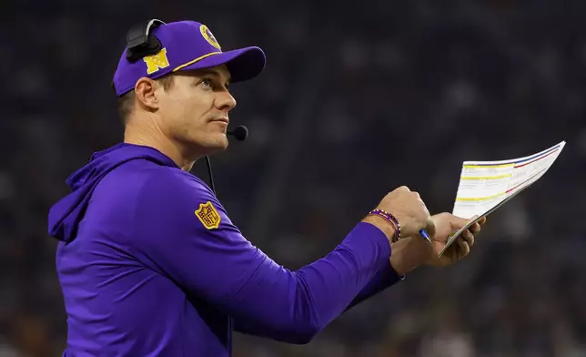 Minnesota Vikings head coach Kevin O'Connell calls a timeout during the first half of an NFL football game against the Green Bay Packers Sunday, Dec. 29, 2024, in Minneapolis. (AP Photo/Bruce Kluckhohn)