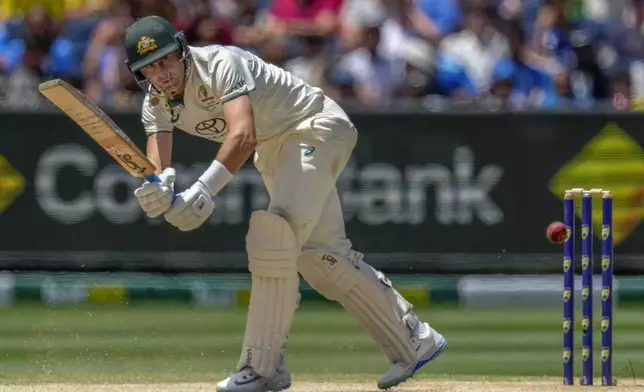 Australia's Marnus Labuschagne plays a shot during play on the day four of the fourth cricket test between Australia and India at the Melbourne Cricket Ground, Melbourne, Australia, Sunday, Dec. 29, 2024. (AP Photo/Asanka Brendon Ratnayake)