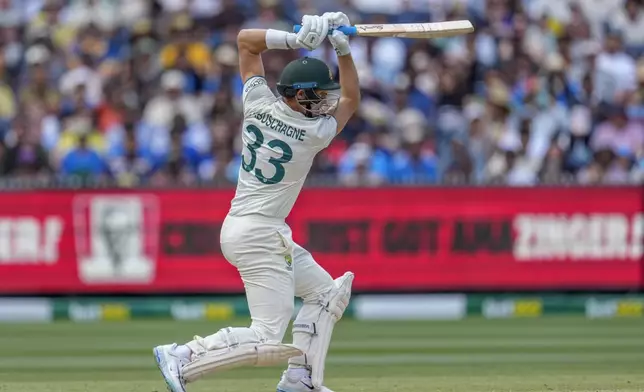 Australia's Marnus Labuschagne hits a boundary during play on the day four of the fourth cricket test between Australia and India at the Melbourne Cricket Ground, Melbourne, Australia, Sunday, Dec. 29, 2024. (AP Photo/Asanka Brendon Ratnayake)