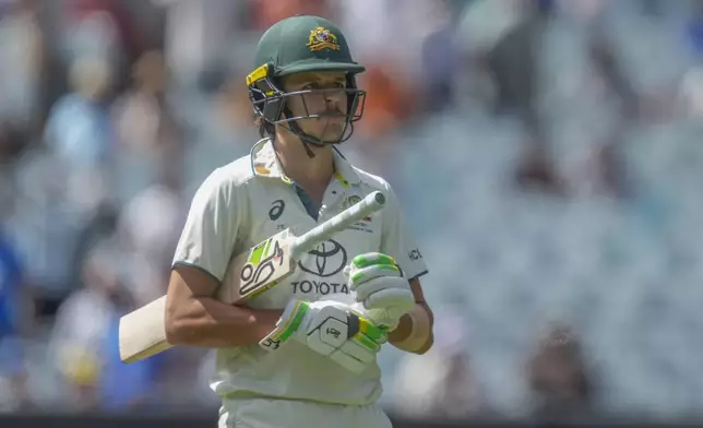 Australia's Sam Konstas walks off the field after losing his wicket during play on the day four of the fourth cricket test between Australia and India at the Melbourne Cricket Ground, Melbourne, Australia, Sunday, Dec. 29, 2024. (AP Photo/Asanka Brendon Ratnayake)