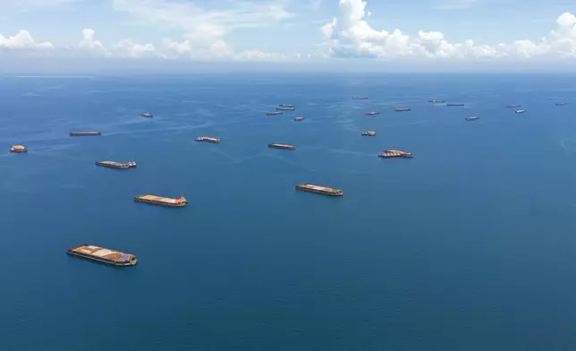 Barges loaded with nickel ore are anchored off Kabaena Island in South Sulawesi, Indonesia, Saturday, Nov. 16, 2024. (AP Photo/Yusuf Wahil)