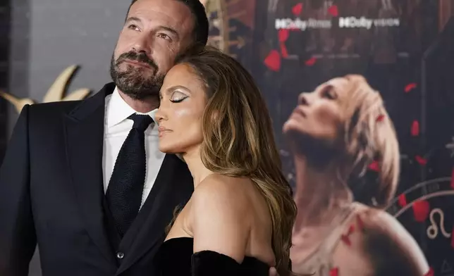 FILE - Ben Affleck, left, and Jennifer Lopez arrive at the premiere of "This Is Me... Now: A Love Story" on Tuesday, Feb. 13, 2024, at the Dolby Theatre in Los Angeles. (Photo by Jordan Strauss/Invision/AP, File)