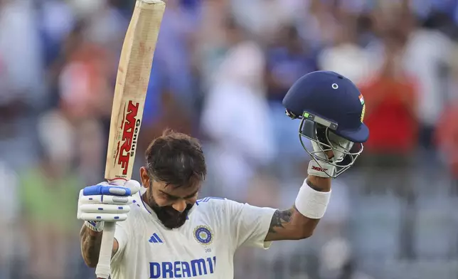 India's Virat Kohli celebrates his century on the third day of the first cricket test between Australia and India in Perth, Australia, Sunday, Nov. 24, 2024. (AP Photo/Trevor Collens)