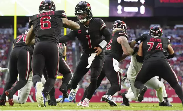 Arizona Cardinals quarterback Kyler Murray (1) hands off to running back James Conner (6) during the second half of an NFL football game against the Seattle Seahawks, Sunday, Dec. 8, 2024, in Glendale, Ariz. (AP Photo/Ross D. Franklin)