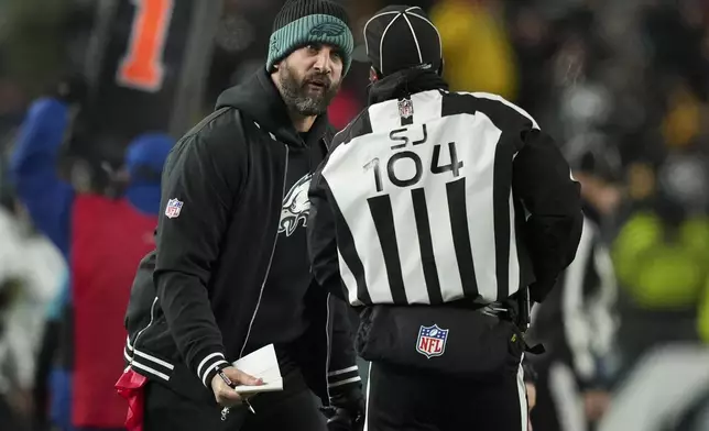 Philadelphia Eagles head coach Nick Sirianni reacts while talking with side judge Dale Shaw (104) during the second half of an NFL football game against the Pittsburgh Steelers on Sunday, Dec. 15, 2024, in Philadelphia. (AP Photo/Matt Slocum)