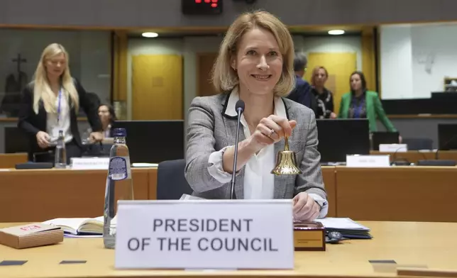 European Union foreign policy chief Kaja Kallas rings a bell to signify the start of a meeting of EU foreign ministers at the European Council building in Brussels, Monday, Dec 16, 2024. (AP Photo/Virginia Mayo)