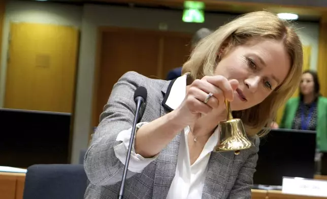 European Union foreign policy chief Kaja Kallas rings a bell to signify the start of a meeting of EU foreign ministers at the European Council building in Brussels, Monday, Dec 16, 2024. (AP Photo/Virginia Mayo)