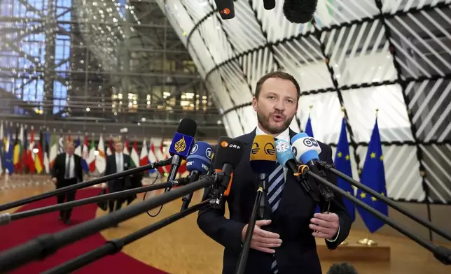 Estonia's Foreign Minister Margus Tsahkna speaks with the media as he arrives for a meeting of EU foreign ministers at the European Council building in Brussels, Monday, Dec 16, 2024. (AP Photo/Virginia Mayo)