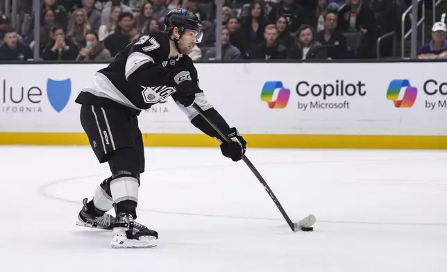 Los Angeles Kings left wing Warren Foegele shoots the puck and scores during the second period of an NHL hockey game, Sunday, Dec. 29, 2024, in Los Angeles. (AP Photo/William Liang)