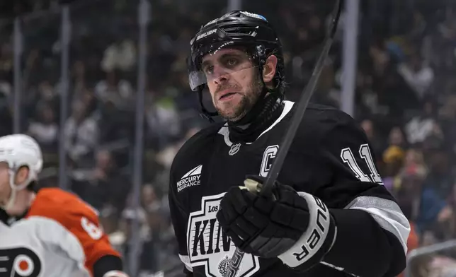 Los Angeles Kings center Anze Kopitar reacts after missing a shot during the second period of an NHL hockey game against the Philadelphia Flyers, Sunday, Dec. 29, 2024, in Los Angeles. (AP Photo/William Liang)